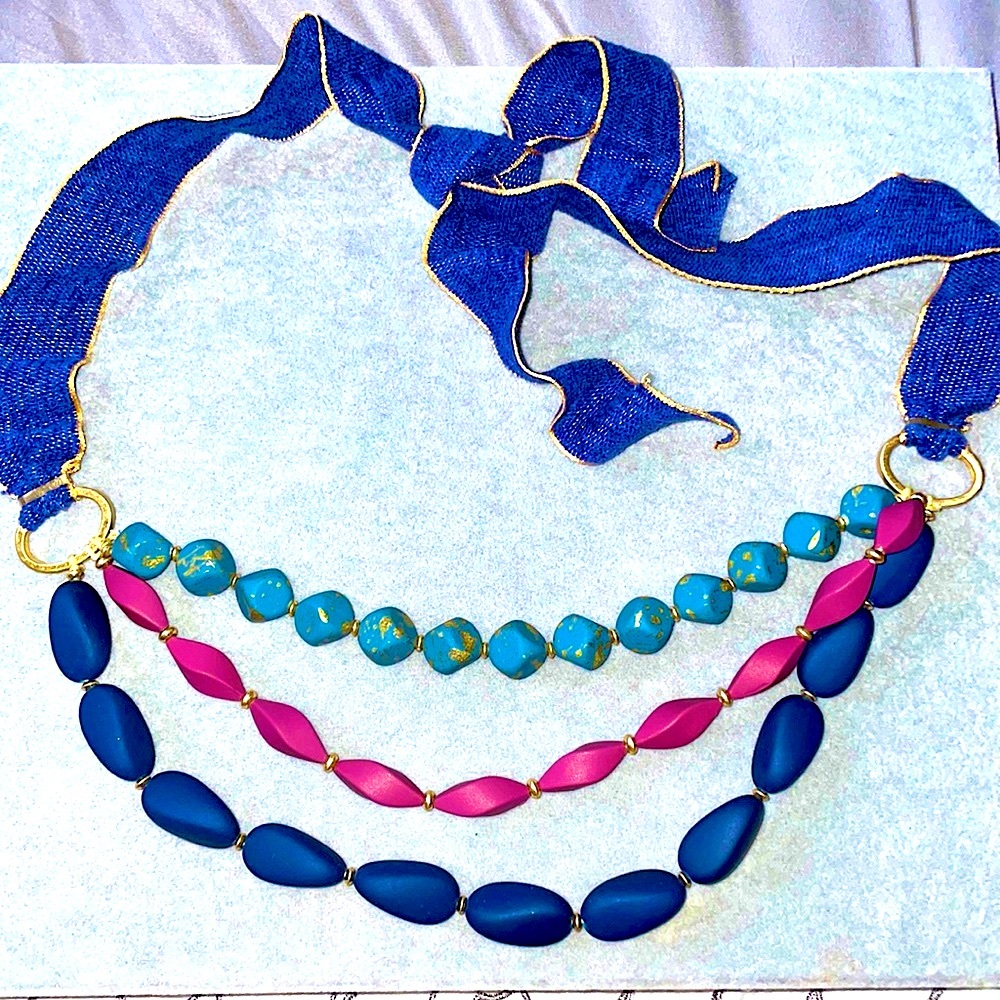 Unique, clay beaded, 3 strand gold and purple chenille ribbon tie necklace.